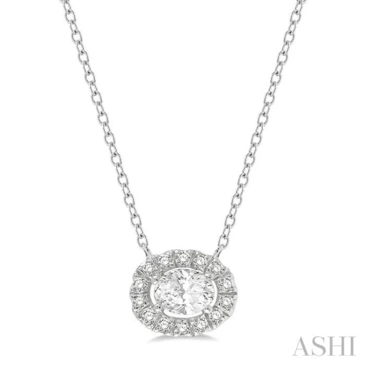 1/4 Ctw Oval and Round Cut Diamond Halo Fashion Pendant With Chain in 14K White Gold